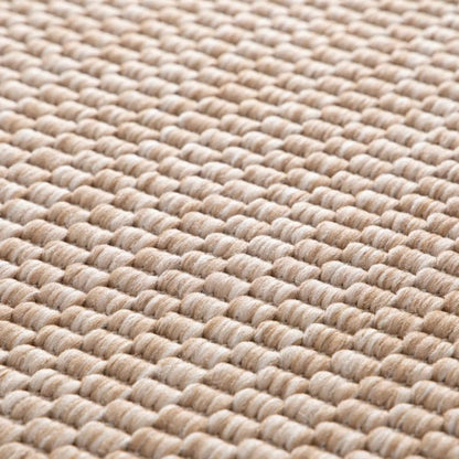 Close-up of a textured beige woven mat