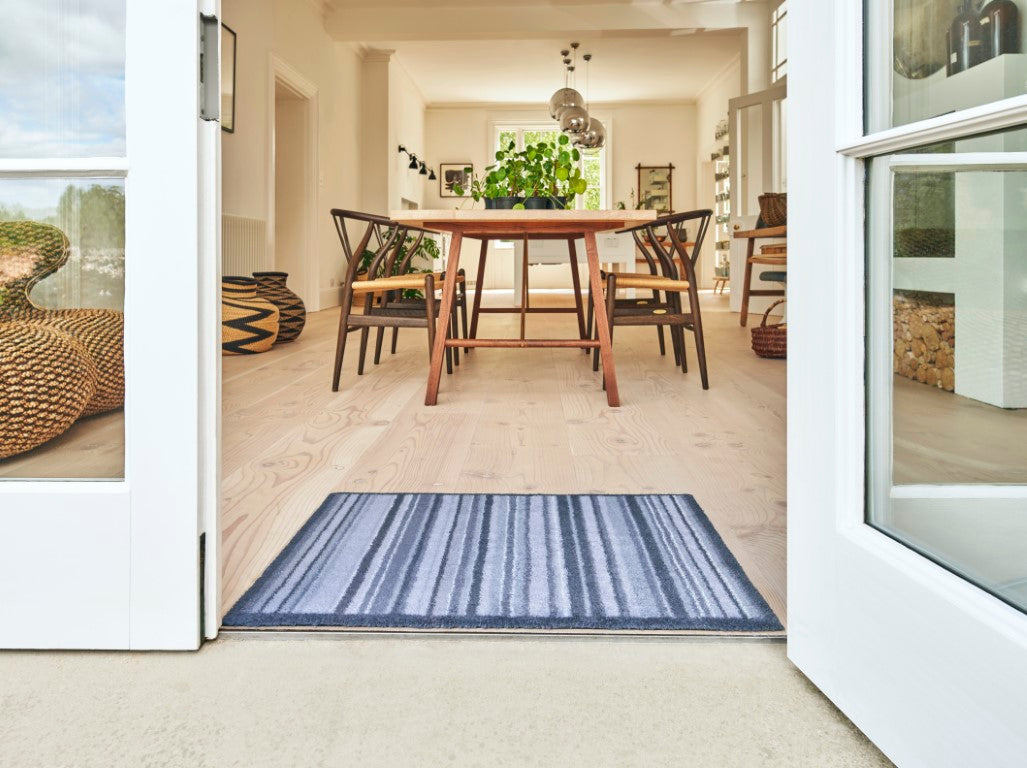 Turtle Mat striped floor mat at an entrance, enhancing home decor and trapping dirt