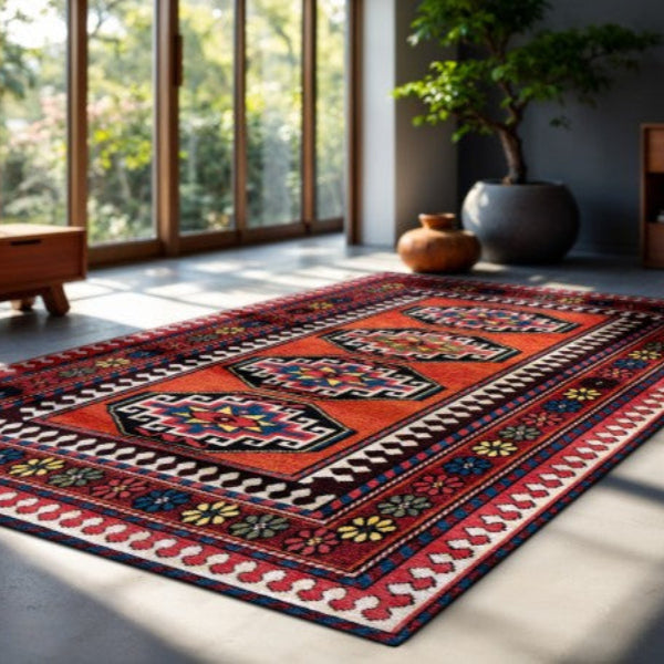 Louis De Poortere Antalia rug with intricate red and multicolour geometric patterns in a modern living room