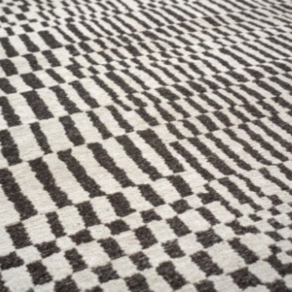 Louis De Poortere Berber Rug with black and white geometric pattern luxury floor decor