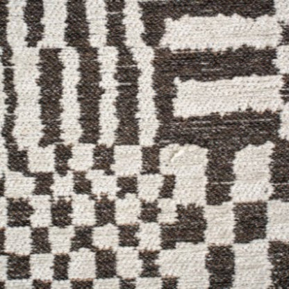 Close-up of Louis De Poortere Berber Rug showing intricate black and white geometric patterns