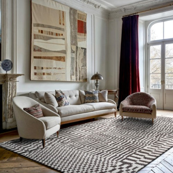 Louis De Poortere Berber Rug in luxury living room with modern beige sofa and armchairs