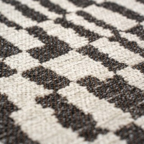 Close-up of luxury Louis De Poortere Berber Rug showing detailed black and white geometric pattern