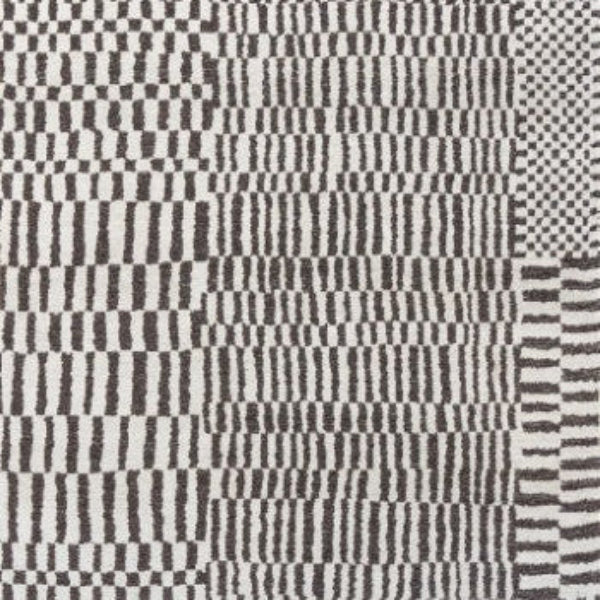 Louis De Poortere Berber Rug luxury design with intricate black and white geometric patterns