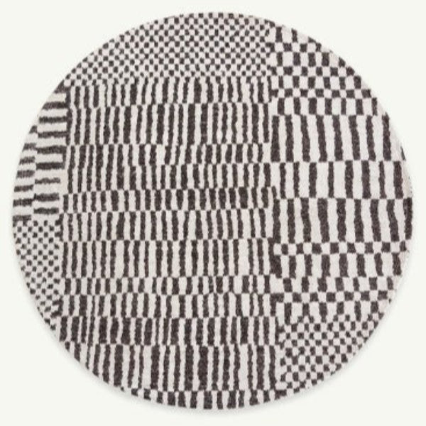 Round Louis De Poortere Berber Rug with black and white geometric checkered pattern