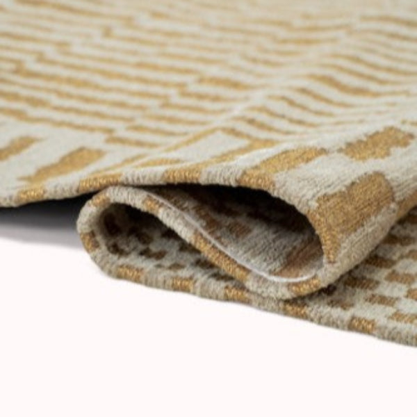louis-de-poortere-berber-rug-closeup-folded-texture-yellow-beige