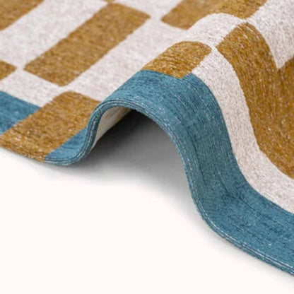 Close-up view of luxury Louis De Poortere Chess rug with blue, brown, and white geometric pattern