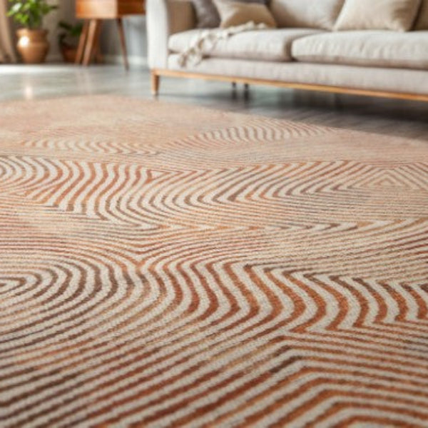 Louis De Poortere Coral rug featuring a modern coral and beige wave pattern in a stylish living room