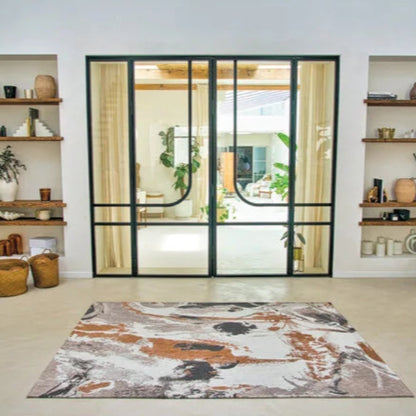 Louis De Poortere Fresque rug with abstract design in a bright modern living room by London Luxury Rugs