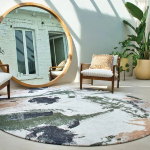 Round Louis De Poortere Fresque rug in neutral tones displayed in a modern living space with wooden chair and large round mirror