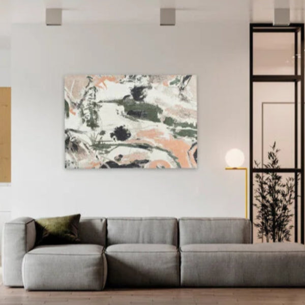 Modern living room with grey sofa featuring a Louis De Poortere Fresque rug and abstract wall art