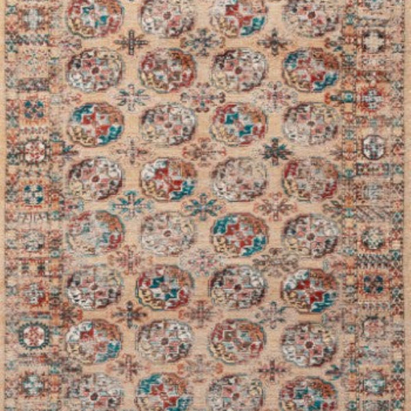Louis De Poortere Kasak rug with intricate traditional patterns and a warm beige, red, and blue colour palette