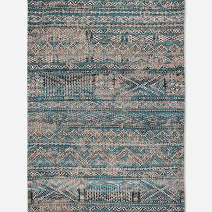 Louis De Poortere kilim rug with intricate geometric patterns in blue and beige tones