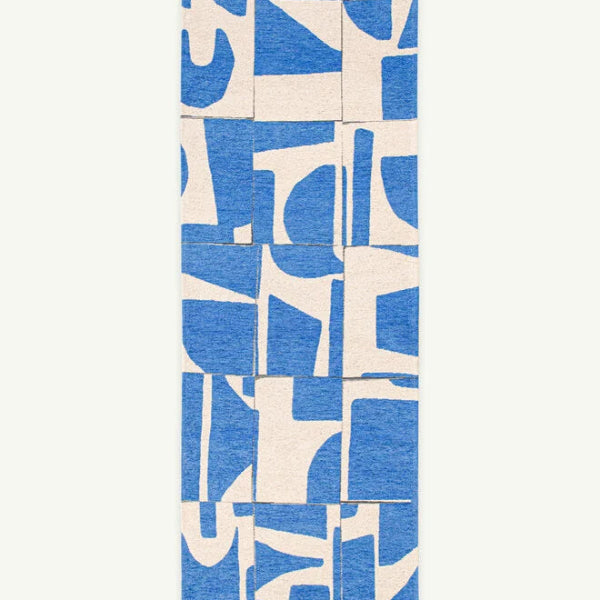 Louis De Poortere Papercut rug with abstract blue and white geometric pattern in luxury design