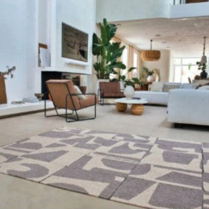 Louis De Poortere Papercut rug with abstract pattern in a modern living room setting