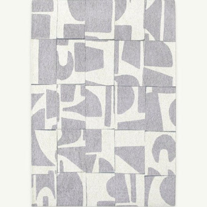 Louis De Poortere Papercut rug luxury design with grey abstract shapes on white background