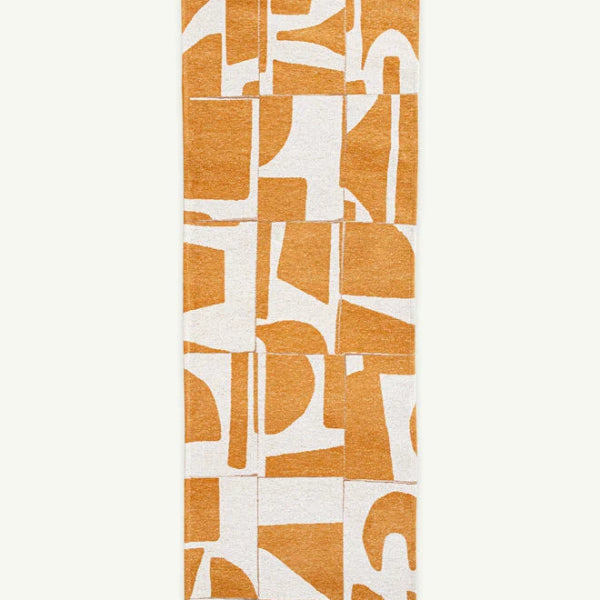 Louis De Poortere Papercut rug with abstract orange and white geometric patterns luxury rug