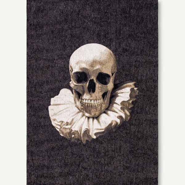 Louis De Poortere Pop rug featuring a detailed skull design with ruffled collar on a dark background