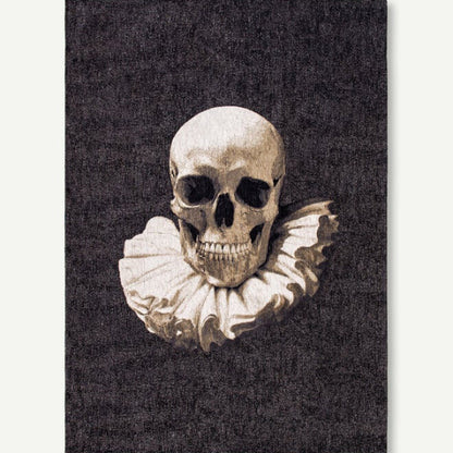 Louis De Poortere Pop rug featuring a detailed skull design with ruffled collar on a dark background