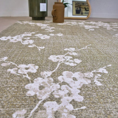 Louis De Poortere Sakura rug with delicate white floral pattern on a soft beige background luxury floor decor