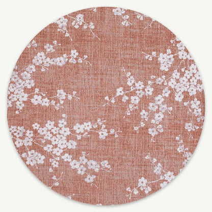 Round Louis De Poortere Sakura rug with delicate white cherry blossom pattern on soft pink background