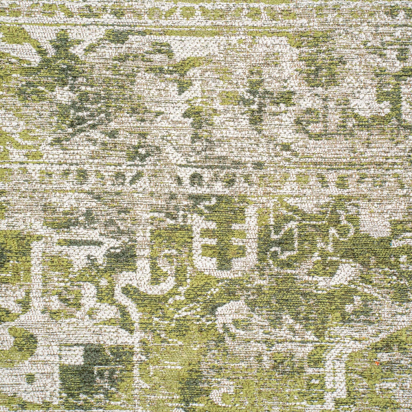 Close-up of luxury Louis De Poortere Tabriz rug with intricate green and beige pattern details