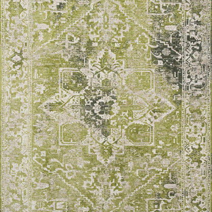 Green and cream Louis De Poortere Tabriz rug with intricate traditional patterns and distressed vintage finish