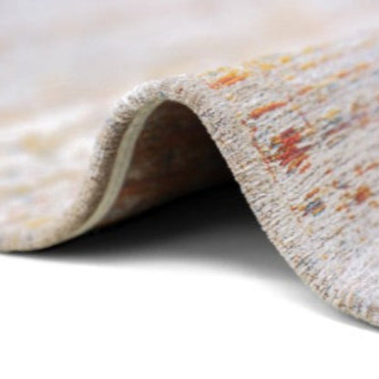 Close-up of a luxury Louis De Poortere Ushak rug showing detailed textured weave with soft colours
