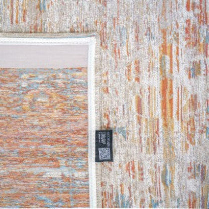 Close-up of a Louis De Poortere Ushak rug showing detailed multicolour pattern and fabric label