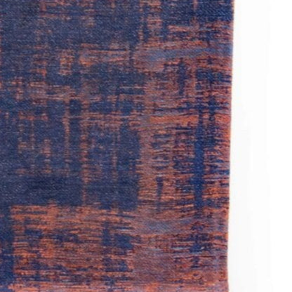 Close-up of Louis De Poortere Venetian Dust rug showing blue and rust textured pattern