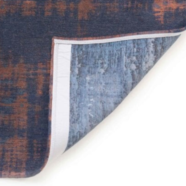 Close-up of the corner of a Louis De Poortere Venetian Dust rug showing fabric texture and border detail