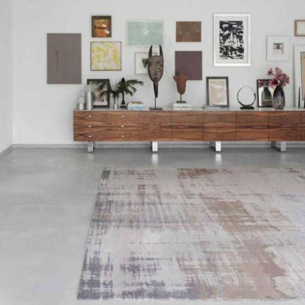 Louis De Poortere Venetian Dust rug in a modern living room with wooden sideboard and wall art