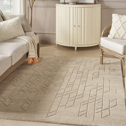 Beige Nourison Alessia rug with geometric pattern in a modern living room setting