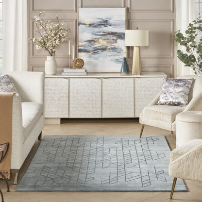Elegant living room featuring a Nourison Alessia rug with geometric pattern in soft grey tones