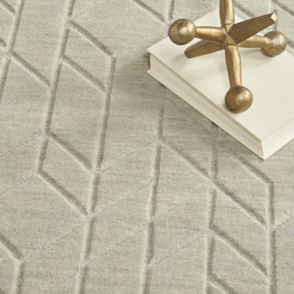 Close-up of the luxury Nourison Alessia rug in neutral tones with geometric embossed pattern