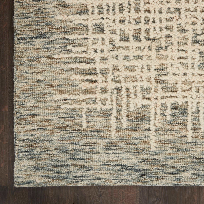 Close-up of Nourison Colorado Rug Geometric Design in neutral tones on dark wooden floor
