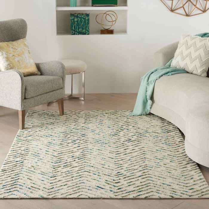 Nourison Colorado Rug Geometric Design luxury rug placed in modern living room with grey armchair and cream sofa