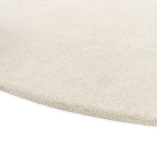Close-up of a beige carpet corner on a white background