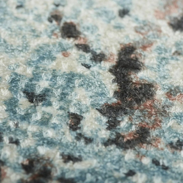 Sintra Teal Viscose Luxury Rug with a textured pattern in shades of teal and soft neutrals