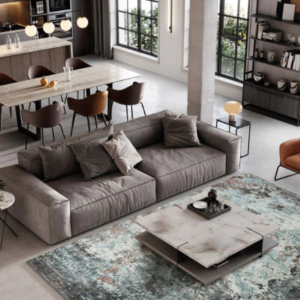 Stylish Sintra Teal Viscose Luxury Rug enhancing a modern living room with elegant furniture