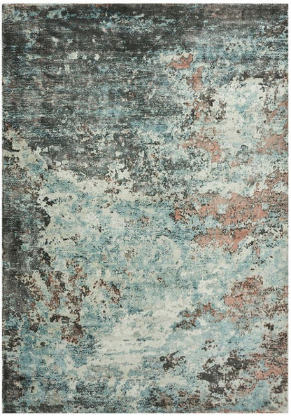 Sintra Teal Viscose Luxury Rug featuring a unique abstract design in teal and brown tones