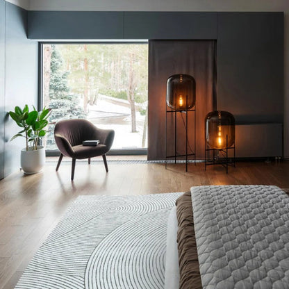 Modern bedroom with a bed, television, and decorative items.