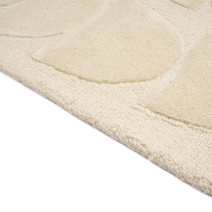 Close-up of a textured beige rug 
on a white background
