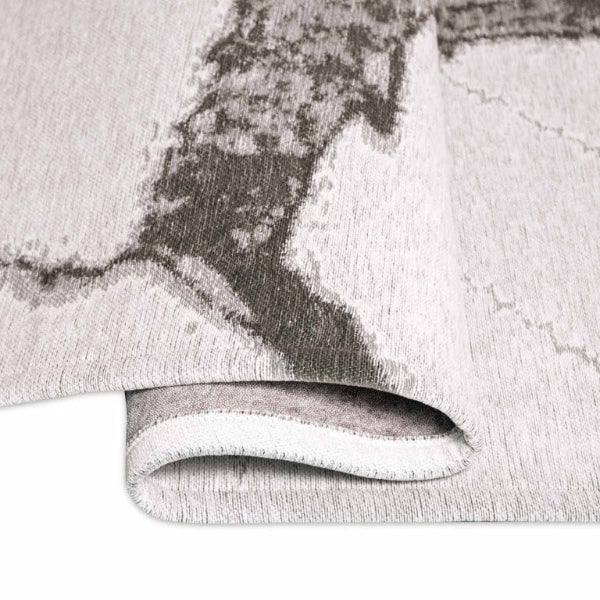 Close-up of a textured gray fabric with a subtle pattern