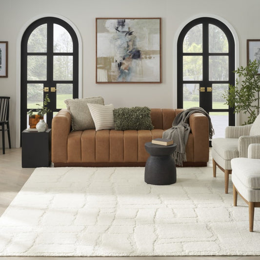 The Blanco Abstract Rug by Nourison in a stylish living room setting with contemporary furniture