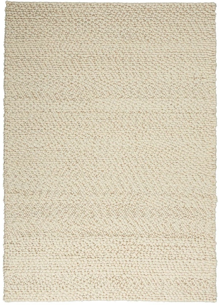 The Calvin Klein Riverstone Rug Collection in soft beige with a textured woven design for modern interiors