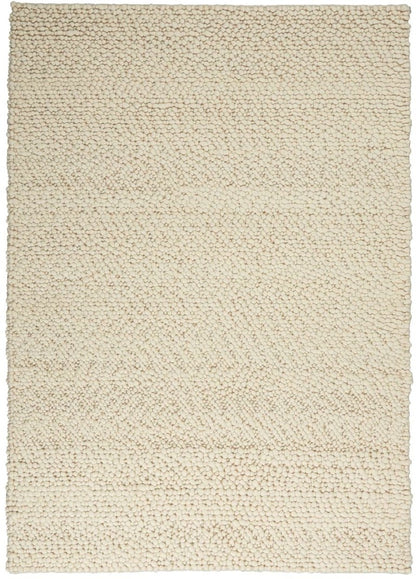 The Calvin Klein Riverstone Rug Collection in soft beige with a textured woven design for modern interiors