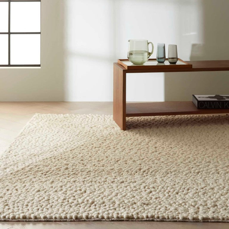 Nourison The Calvin Klein Riverstone Rug Collection in soft beige, enhancing modern interior decor