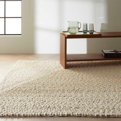 Nourison The Calvin Klein Riverstone Rug Collection in soft beige, enhancing modern interior decor