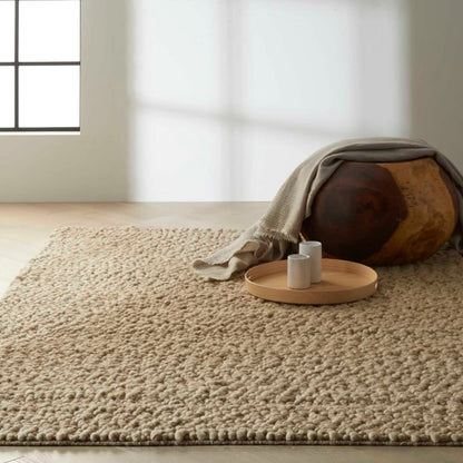 Nourison The Calvin Klein Riverstone Rug Collection in a natural beige tone, perfect for luxury interiors